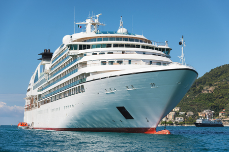 white passenger ship anchored on the coastの写真素材