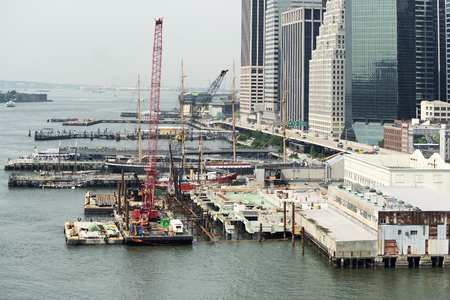 NEW YORK CITY, USA - JUNE 12, 2015: Construction site and pier on Hudson river, along the highway in New York City.のeditorial素材