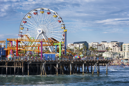 SANTA MONICA, USA - JUNE 19: The amusement park on the Santa Monica Pier, Los Angeles California on June 19, 2016. The pier is popular as a landmark that is over 100 years oldのeditorial素材