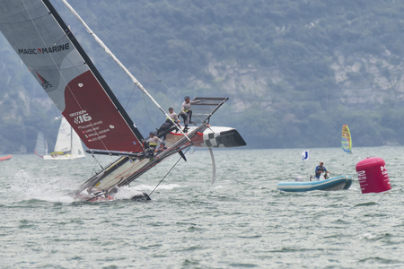 RIVA DEL GARDA, ITALY - AUGUST 19: first day of competition for M32 series mediterranean, a sailing fast catamaran competition on Garda lake. on august 19, 2016 in Riva del Garda, Italy.のeditorial素材