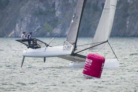 RIVA DEL GARDA, ITALY - AUGUST 19: first day of competition for M32 series mediterranean, a sailing fast catamaran competition on Garda lake. on august 19, 2016 in Riva del Garda, Italy.のeditorial素材