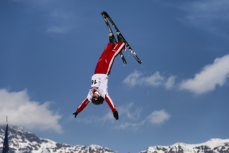 CHIESA VALMALENCO, ITALY - MARCH 31, 2017: Freestyle Ski FIS European Cup, athlete jumpのeditorial素材