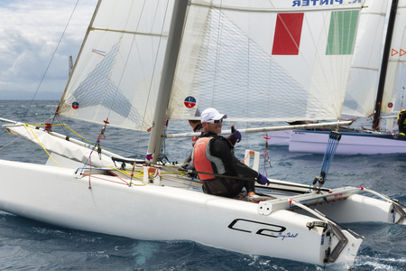 PUNTA ALA - 3 JUNE: athletic men on sail boat during Formula 18 national catamaran regatta, on June 3 2016 in Punta Ala, Italyのeditorial素材