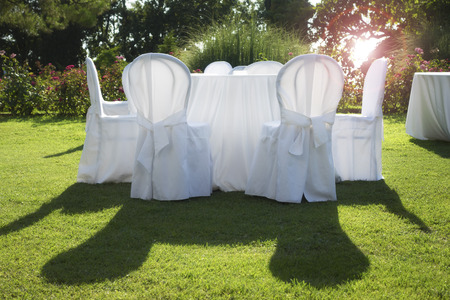 white table in the garden at wedding partyの写真素材