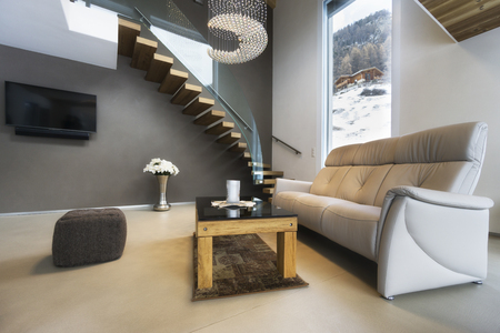 living room of luxury house with mountain view in modern designの写真素材