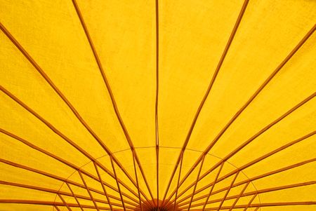 A detail image of a yellow parasolの写真素材