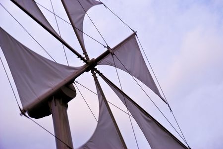 A windmill with white sailsの写真素材