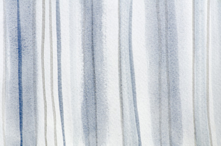 Vertically blue and grey lines painted in watercolor on a horizontal paper.の写真素材
