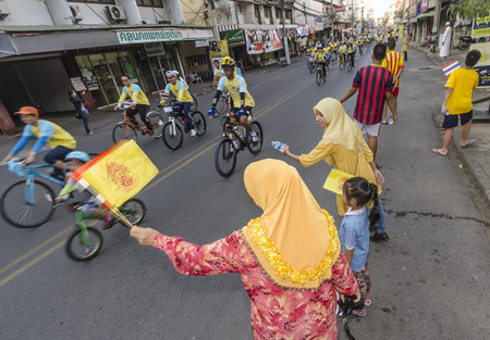 Chiang Mai, Thailand - December 11, 2015: Muslim women cheer passing cyclists at the Bike For Dad event, on December 11, 2015 in Chiang Mai, Thailand. The Bike For Dad cycling event attracts hundreds of thousands of cyclists and is held across Thailand toのeditorial素材