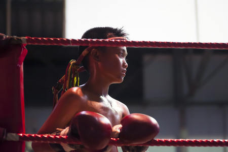 Hua Hin, Thailand - January 8, 2016: A young Muay Thai boxer for his fight to begin at the boxing stadium in Hua Hin, Thailand on January 8, 2016. Muay Thai boxing is considered by many as the national sport of Thailand.のeditorial素材