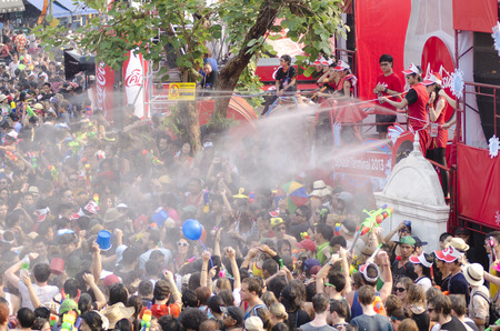 Chiang Mai, Thailand - April 14, 2014: A group of people is sprayed with water by staff at the Air Asia stage at the Songkran festival in Chiang Mai, Thailand on April 14, 2014.のeditorial素材