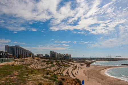 Sunny Mediterranean coastline with blue sky and some cloudsの写真素材