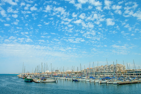 Sunny Mediterranean coastline with blue sky and some cloudsの写真素材