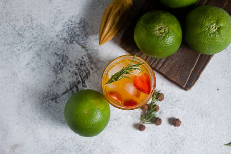 fresh orange squeeze and slice strawberry with fresh fruits on white backgroundの写真素材