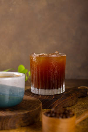 aromatic coffee from fresh roasted coffee bean to pouring become hot or cold black coffee at wooden rustic trayの写真素材