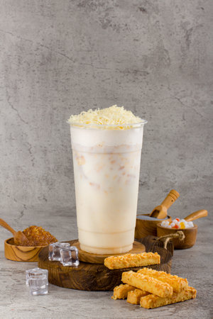 Boba or tapioca pearls is taiwan bubble milk tea in plastic cup with cheese cream flavor on texture  background, summers refreshment.の写真素材