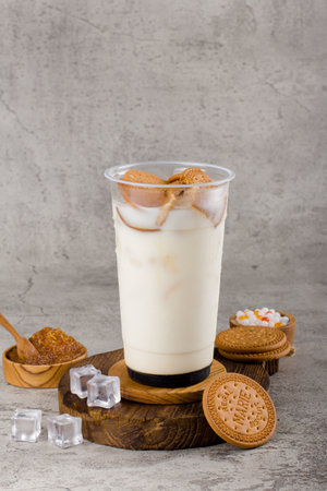 Boba or tapioca pearls is taiwan bubble milk tea in plastic cup with Cookies flavor on texture  background, summers refreshment.の写真素材