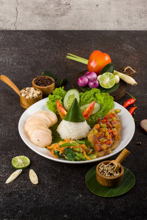 Thai food, spicy curry with rice and vegetable on black backgroundの写真素材