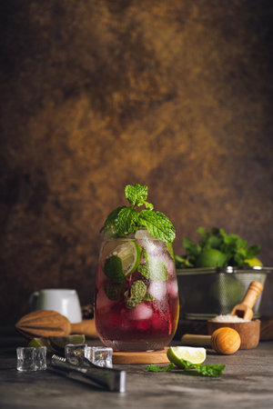 Fresh strawberry summer mojito cocktail with strawberry, lime, mint, rum and ice cubes.の写真素材