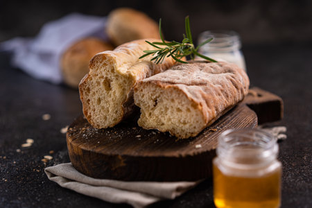 Fresh homemade artisan loaf of baguette breads on rustic background with copy space. sourdough mini baguette breads.の写真素材