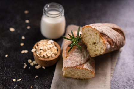 Fresh homemade artisan loaf of baguette breads on rustic background with copy space. sourdough mini baguette breads.の写真素材