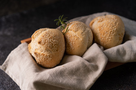 The homemade sourdough sesambrÃ¶tchen bread buns with sesame seeds. Artisan bakeryの写真素材