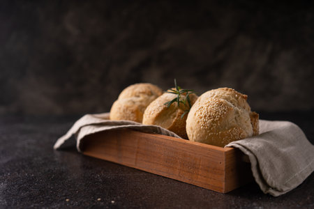 The homemade sourdough sesambrÃ¶tchen bread buns with sesame seeds. Artisan bakeryの写真素材