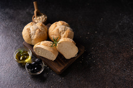 Fresh baked sourdough sesambrÃ¶tchen bread buns with sesame seeds. Artisan bakeryの写真素材