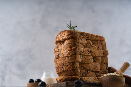 Fresh Sliced Homemade Wholegrain Wheat Bread whit olive oil on white rustic background. Artisan Sourdoughの写真素材