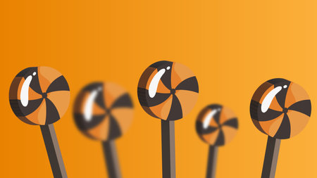 Bright orange Christmas candy lollipops with shiny 3D reflectionsの写真素材