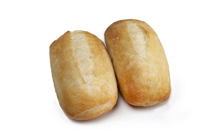 two buns with a golden crust on a white background close-upの写真素材