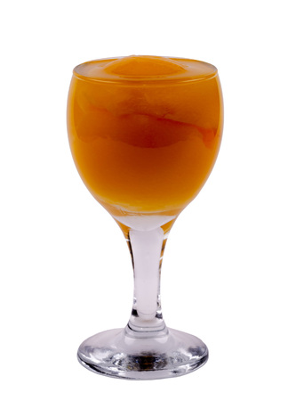 Transparent wine glass with a peach inside on a white background, side viewの写真素材