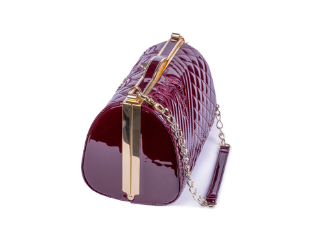 women bag made of patent leather, color brown, on a white backgroundの写真素材