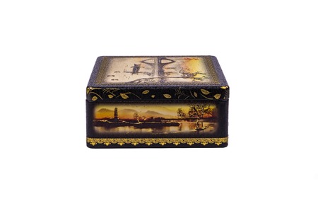 Old metal box with vintage pictures isolated on white backgrounの写真素材