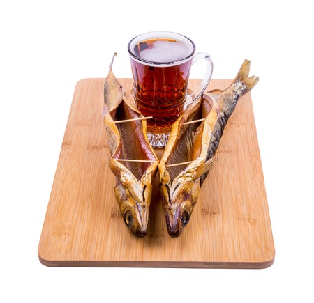 beer and fish on the boardの写真素材