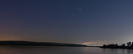 Russia, night landscape on the Angara river and night sky with starsの写真素材