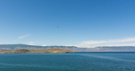 Beautiful view of Lake Baikal on a clear summer day from the shore of Olkhon Island