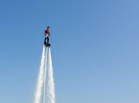 Russia Zhukovsky August 30, 2019 flyboarders show at the air show max 2019 photo taken in the summer on a sunny dayのeditorial素材