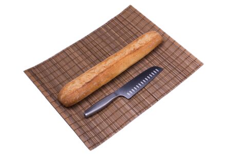 whole bread baguette and knife, photo on a white background, object isolated