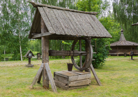 Russia June 29, 2020 Kostroma, view of an old wooden well in the Russian Art Park in Kostroma, photo was taken on a cloudy summer dayのeditorial素材