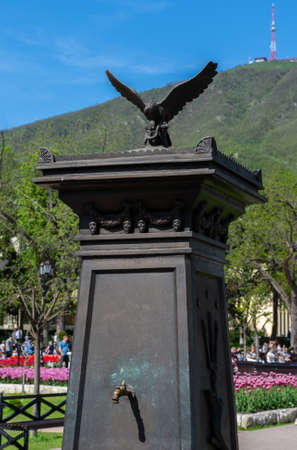 Russia May 3, 2021 Pyatigorsk, Sculpture of an eagle in the city park flower garden. Photo taken on a sunny dayのeditorial素材
