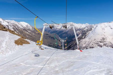 view of the lifts on the slope of Mount Cheget, photo taken on a sunny spring day