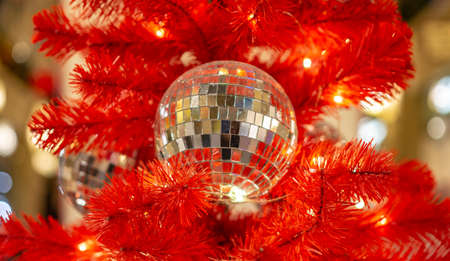 bright background of decorations on the New Year's tree, but the branches of an artificial yalka balls and lights, close-up photoの写真素材