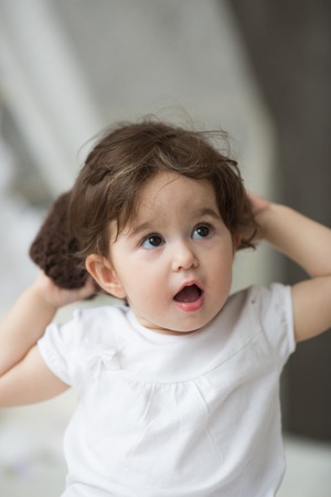 Happy little girl with brown hat