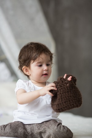 Happy little girl with brown hatの写真素材