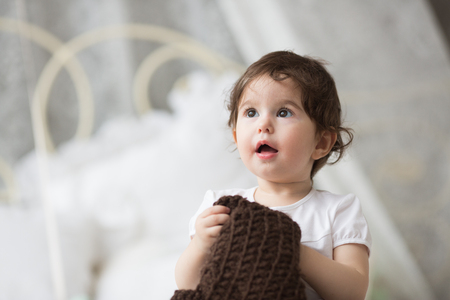 Happy little girl with brown hatの写真素材