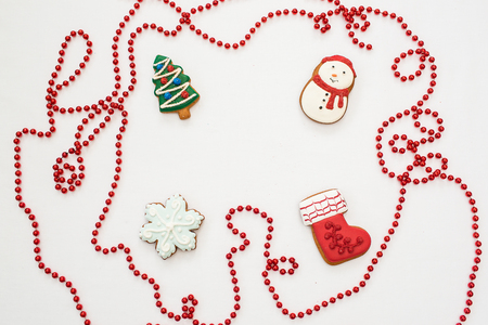 Gingerbread cookies hanging over white backgroundの写真素材