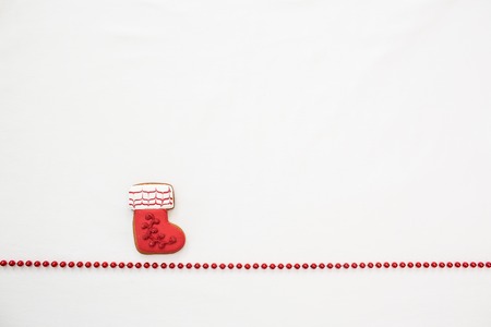 Gingerbread cookies hanging over white backgroundの写真素材