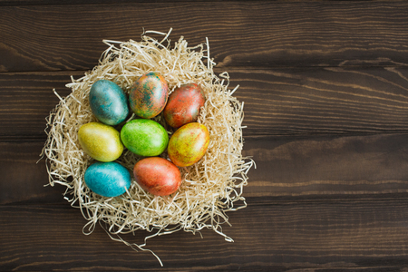 Easter eggs on wooden backgroundの写真素材
