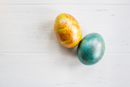 Easter eggs on white wooden backgroundの写真素材